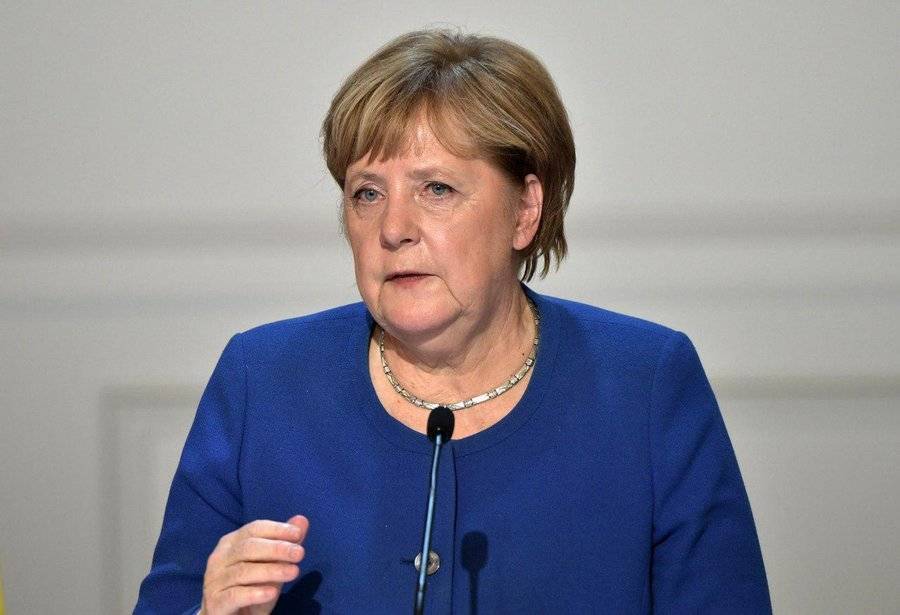 Меркель назвала Путина победителем на саммите в Париже