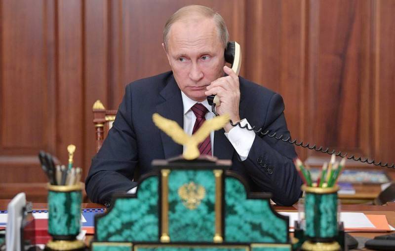 Путин провел телефонную беседу с Меркель и Макроном