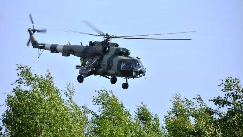 Фото с места падения военного вертолета на Украине появились в сети