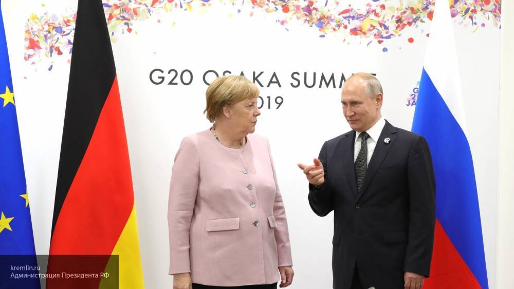 Путин и Меркель на встрече в Осаке договорились продолжить работу в «нормандском формате»
