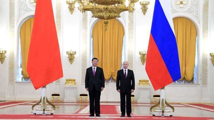 Россия и Китай будут развивать практику расчетов в нацвалютах — Путин