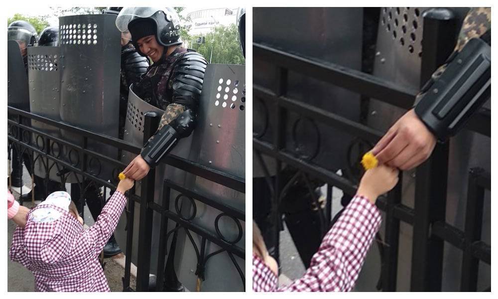 "Подарила людям свет": фото с девочкой и полицейским на митинге в Нур-Султане покорило Казнет