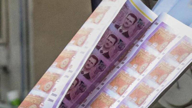 Опубликовано фото банкнот, которые Россия печатает для Сирии