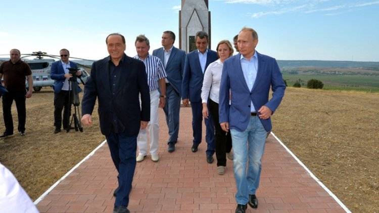 Путин провел короткую встречу с Берлускони