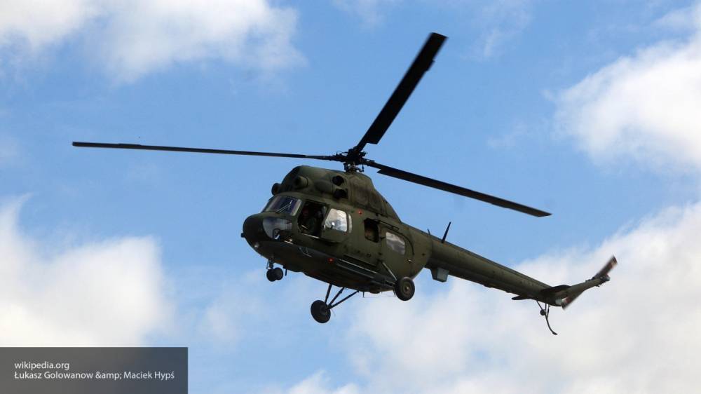 Спасатели нашли совершивший жесткую посадку вертолет Ми-2 в лесу в Якутии