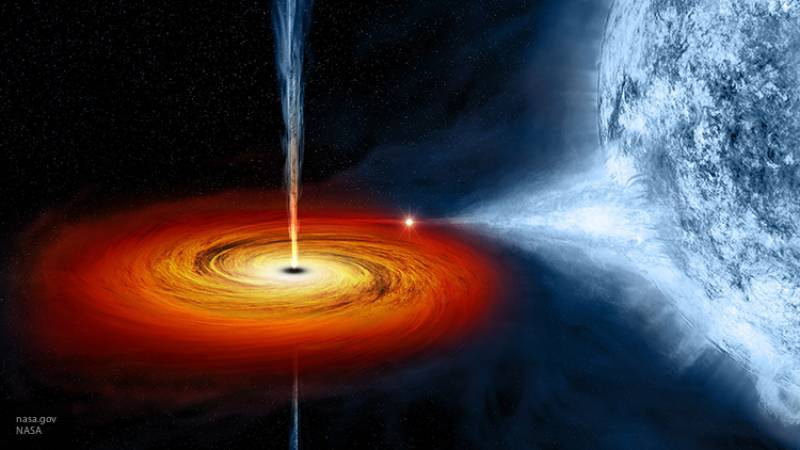 Черная дыра в центре галактики стала светиться ярче из-за поглощения небесных тел