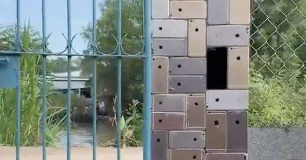 Мастер по ремонту телефонов построил забор из iPhone (видео)