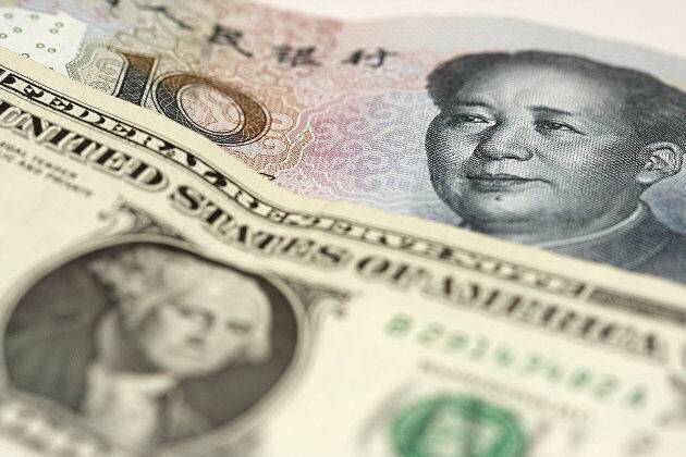 Курс юаня к доллару упал на факторах коронавируса, рынка недвижимости и новостях из Тайваня