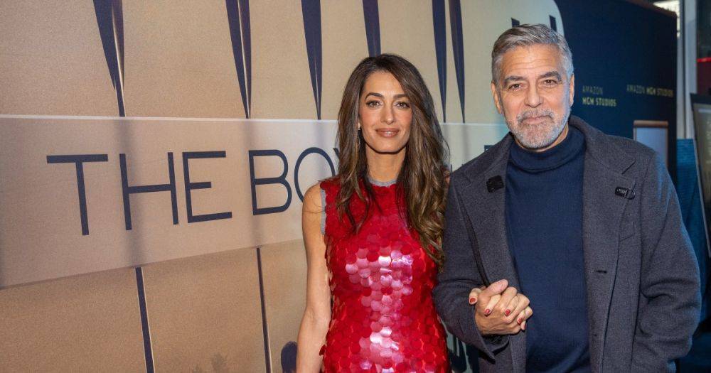 Джордж и Амаль Клуни держались за руки на красной дорожке (фото)