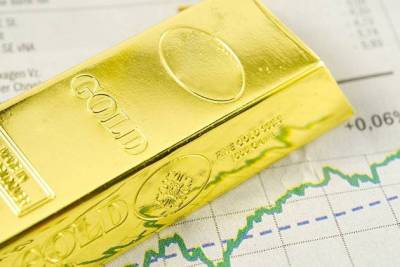 Золото дешевеет на общем падении мировых рынков