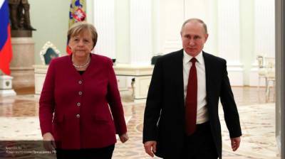 Путин отправил поздравление Меркель с Днем германского единства