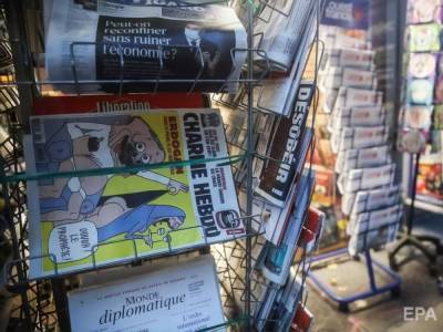 "Франция всегда останется Францией". На обложке Charlie Hebdo изобразили танцовщиц "Мулен Руж" с отрезанными головами