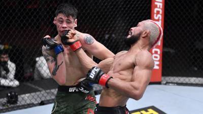 Чемпионский бой между Фигейредо и Морено на UFC 256 завершился вничью