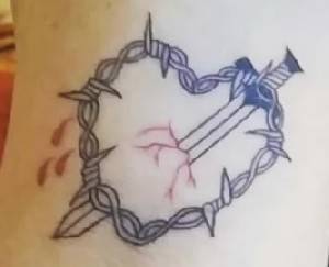 Полиция допросила женщину по поводу татуировки, адресованной Ганцу