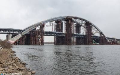Хищения на строительстве Подольского моста: в Киеве прошли обыски