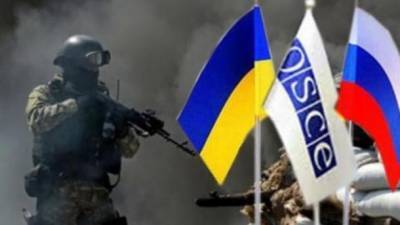 Трехсторонняя группа договорилась о "полном прекращении огня" на Донбассе с 27 июля