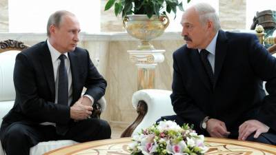 Путин сообщил Лукашенко о разговоре с Меркель и Макроном