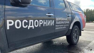 Дорожники проверили на прочность новый асфальт на Токсовском шоссе