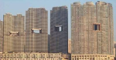 «Дырявые» небоскребы, или Зачем в Гонконге строят здания со сквозными отверстиями