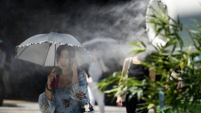 Жители Японии страдают от изнурительной жары