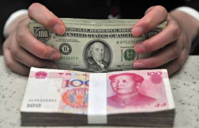Китайский ЦБ укрепил курс юаня к доллару до прошлогоднего уровня