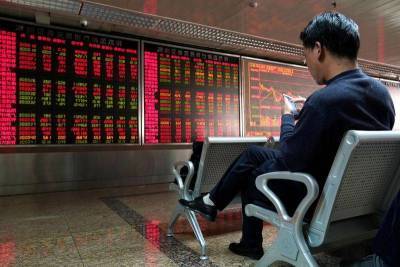 Китайские акции закрылись снижением после сохранения кредитной ставки 5 месяц кряду