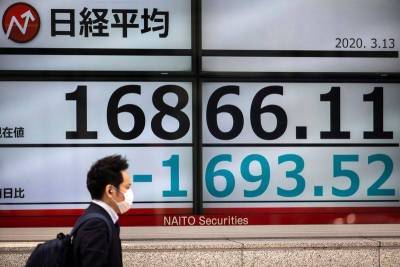 Японские акции закрылись в минусе из-за опасений о пандемии
