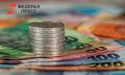 Центробанк повысил курс доллара до 77 рублей