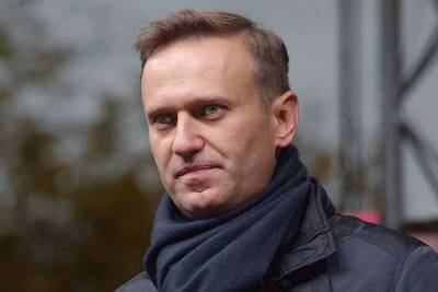 Навального в московском аэропорту уже ожидает ОМОН