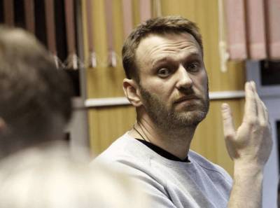 Оппозиционера Навального задержали после возвращения в Россию