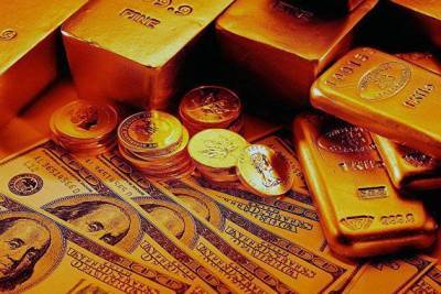 Золото дорожает на ослаблении доллара