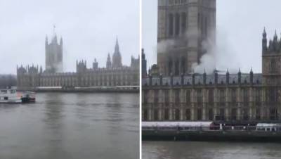 Дым поднимается над зданием парламента Великобритании