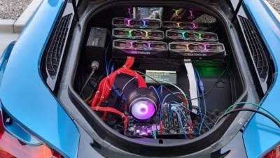 Американец добывает криптовалюту в багажнике BMW i8: впечатляющие фото