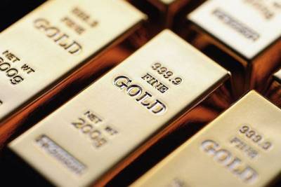 Золото торгуется у максимумов с ноября на ослаблении доллара