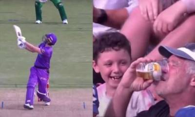 Пожилой фанат крикета поймал мяч своим пивным стаканом во время матча (2 фото + 1 видео)