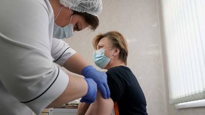 Мишустин заявил о вакцинации от COVID-19 почти трети населения РФ
