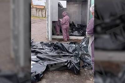 Лежащие на земле пакеты с трупами в российском городе объяснили