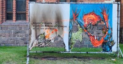ФОТО: вандалы подожгли плакат в поддержку художника Бректе
