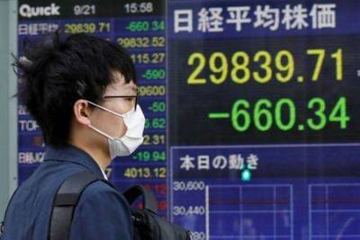 Японские акции закрылись снижением на фоне беспокойства из-за Evergrande