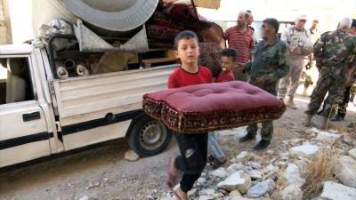 Беженцы возвращаются в сирийский город Хиш