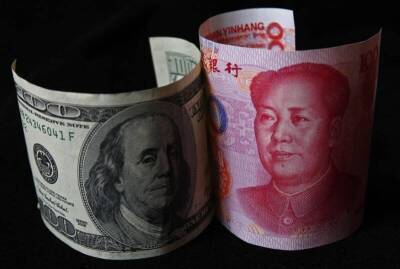 Доллар растет вместе с юанем