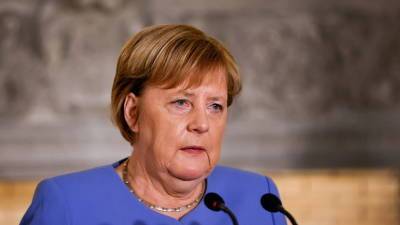 NI считает маловероятным изменение политики Германии в отношении России после ухода Меркель