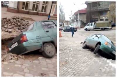 Решил припарковаться: в Одессе легковушка "ушла" в разрытую яму, кадры