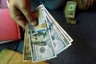 Средний курс доллара США со сроком расчетов "завтра" по итогам торгов составил 73,4891 руб.