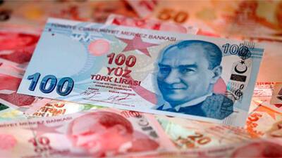 Лира упала до нового антирекорда на решении ЦБ Турции понизить процентную ставку до 14%