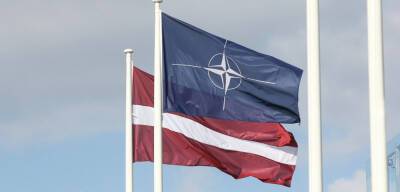 Как Латвия напоминает, что она член НАТО