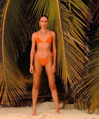 Жарко, как в тропиках: модель Кэндис Свейнпол в соблазнительной фотосессии купальников