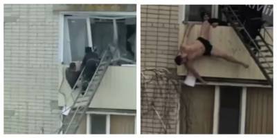 Под Харьковом мужчина повис на балконе, кадры событий: "Пытались затащить его внутрь, но..."
