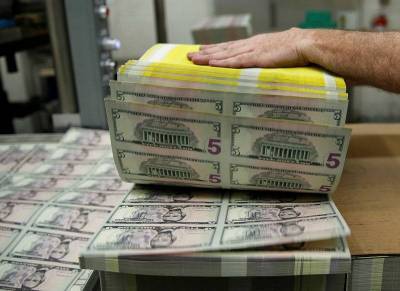 Средневзвешенный курс доллара США к российскому рублю со сроком расчетов "завтра" по состоянию на 11:30 мск 22 февраля составил 74,4669 руб.