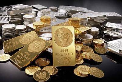 Золото и серебро умеренно дешевеют на сильном долларе